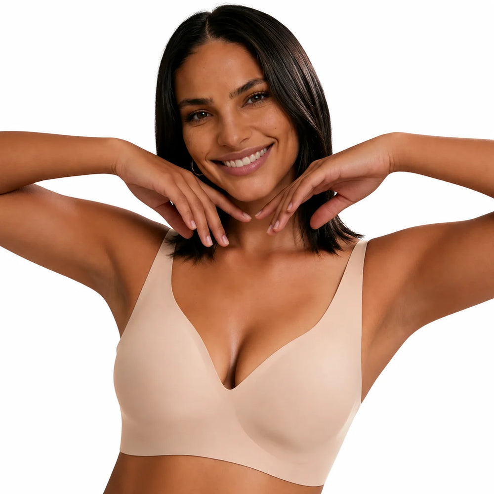 Reggiseno Lovelle senza cuciture e senza ferretto color nude, indossato con le braccia alzate